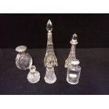 A COLLECTION OF CUT GLASS AND SILVER MOUNTED PERFUME BOTTLES
