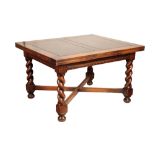 AN OAK DRAW LEAF DINING TABLE IN 17TH CENTURY STYLE