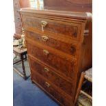 A CONTINENTAL GRAINED PINE CHEST OF DRAWERS