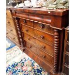 A VICTORIAN FLAME MAHOGANY CHEST OF DRAWERS, WITH TURNED FLANKING PILLARS