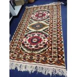 A CREAM GROUND PERSIAN DESIGN RUG