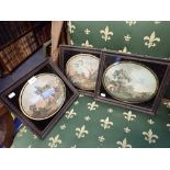 THREE REGENCY ENGRAVINGS OF RURAL SCENES, IN OVAL VERRE EGLOMISE MOUNTS