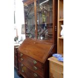 A GEORGE III STYLE MAHOGANY BUREAU BOOKCASE