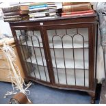A 1920S MAHOGANY SERPENTINE FRONTED DISPLAY CABINET