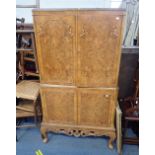 A 1950S PALE BURR WALNUT COCKTAIL CABINET