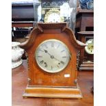 AN EDWARDIAN WALNUT CASED MANTEL CLOCK