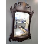 A GEORGE III STYLE MAHOGANY WALL MIRROR