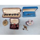 A CASED SET OF SIX ABALONE SHELL WAISTCOAT BUTTONS