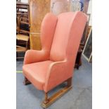 AN ARTS & CRAFTS OAK WINGBACK ARMCHAIR