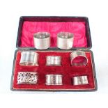 A PAIR OF ENGINE TURNED SILVER NAPKIN RINGS