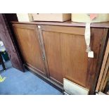 A MAHOGANY TWO DOOR CUPBOARD