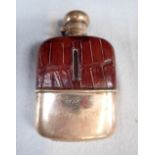 A SILVER MOUNTED AND LEATHER COVERED HIP FLASK
