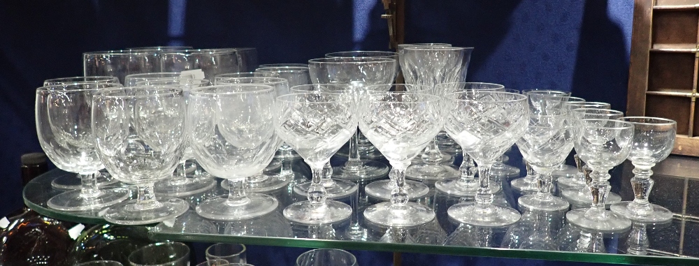 A COLLECTION OF FACETED DRINKING GLASSES