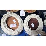 A PAIR OF EARLY 20TH CENTURY BELLEEK OVAL PHOTOGRAPH FRAMES