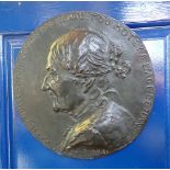 A PATINATED BRONZE PORTRAIT PLAQUE, SIGNED 'F. ROLARD 1891'