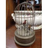 A VICTORIAN STYLE AUTOMATON, SINGING BIRDS IN A BIRDCAGE