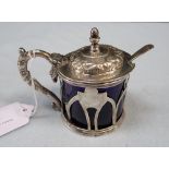 AN UNMARKED WHITE METAL LIDDED MUSTARD POT