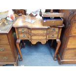 A REPRODUCTION FIGURED WALNUT LOWBOY