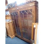 A GEORGE III STYLE GLAZED BOOKCASE