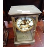 AN EDWARDIAN BRASS CASED MANTEL CLOCK