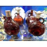 FOUR BROWN GLASS DECANTERS