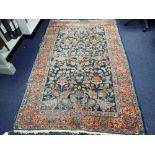 A BLUE GROUND PERSIAN RUG