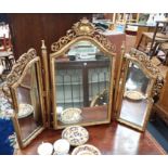 A ROCOCO STYLE GILT TRIPLE DRESSING MIRROR