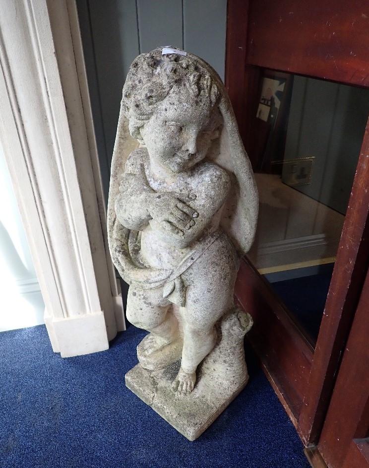 A RE-CONSTITUTED STONE GARDEN STATUE OF A CHILD