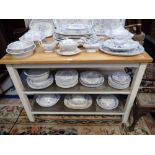 A CONTEMPORARY WHITE PAINTED KITCHEN ISLAND