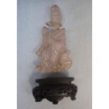 A CHINESE ROCK CRYSTAL FIGURE