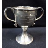 A SILVER TROPHY CUP