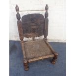 A NORTH AFRICAN TRIBAL LOW CHAIR