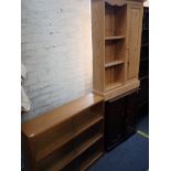 A MID-CENTURY MODERN PALE OAK BOOKCASE WITH SLIDING GLASS DOORS