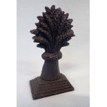 A 19TH CENTURY CAST IRON DOOR STOP