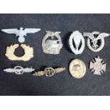 A COLLECTION OF NAZI STYLE MILITARY BADGES