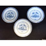 THREE DELFTWARE PLATES PAINTED WITH A WILLOW TREE ON AN ISLAND