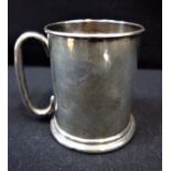 A SMALL SILVER TANKARD