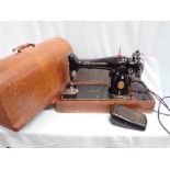 A VINTAGE SINGER SEWING MACHINE