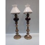 A PAIR OF 19TH CENTURY SILVER PLATED ON COPPER CANDLESTICKS