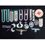 A COLLECTION OF NAZI STYLE MILITARY BADGES