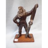 A BRONZED SPELTER TABLE LIGHTER IN THE FORM OF A PILOT