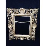 A FLORENTINE GILTWOOD FRAME