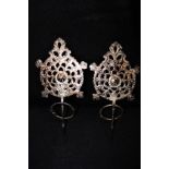 A PAIR OF EASTERN WHITE METAL ADORNMENTS