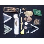 A COLLECTION OF NAZI STYLE MILITARY BADGES