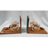 A PAIR OF MODEL CANNON, ON STANDS AS BOOKENDS