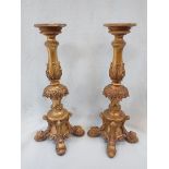 A PAIR OF REPRODUCTION ALTAR STYLE GILT CANDLESTICKS