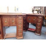 A WALNUT CASED SINGER TREADLE SEWING MACHINE