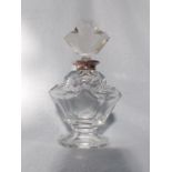 A CUT GLASS PERFUME BOTTLE, WITH SILVER COLLAR