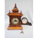 AN EDWARDIAN WALNUT CASED MANTEL CLOCK