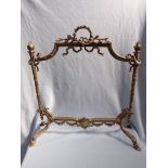 A LOUIS XIV STYLE BRASS FIRE GUARD SURROUND